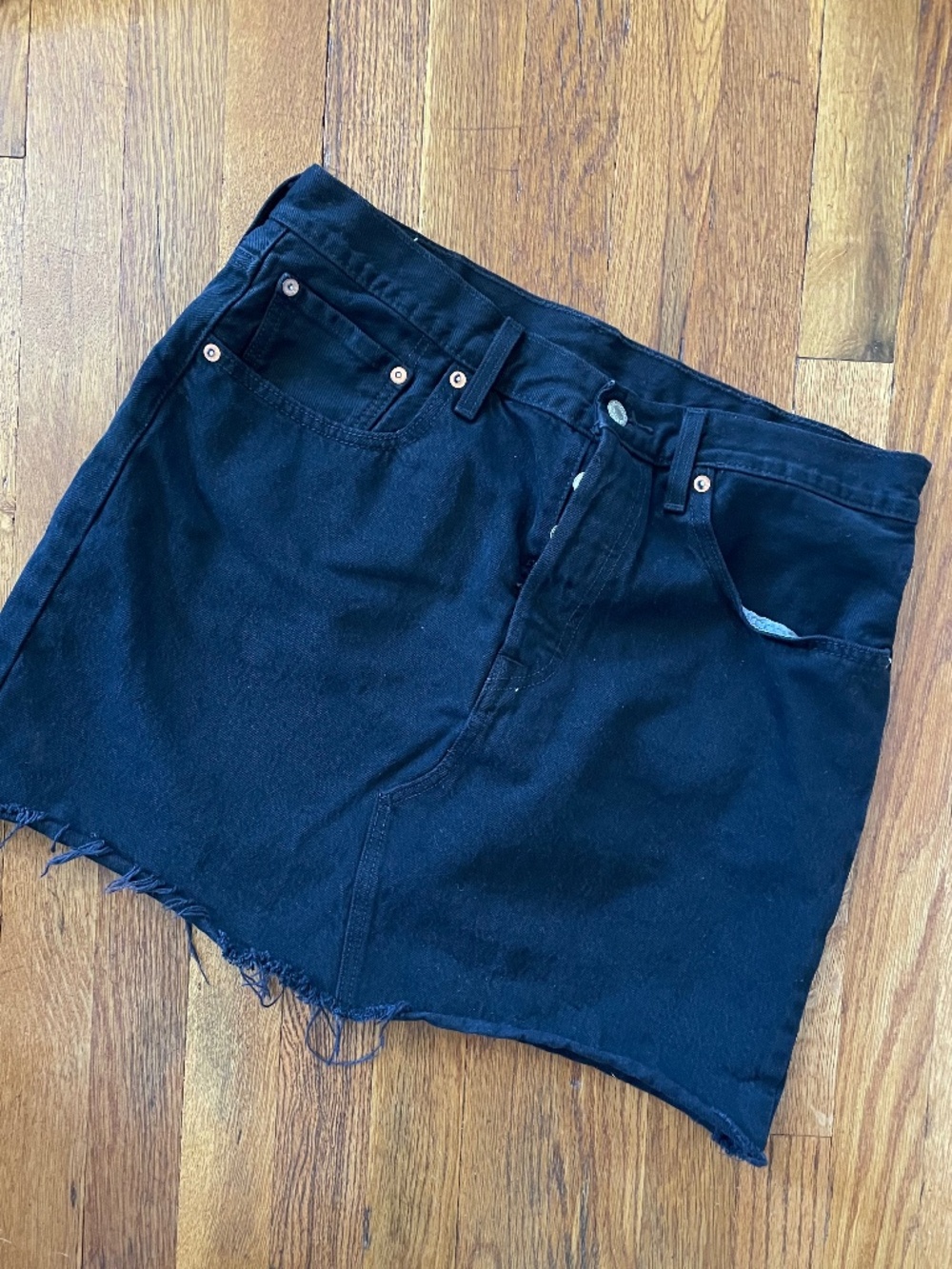 Levi’s Premium black denim mini skirt raw hem size 31
